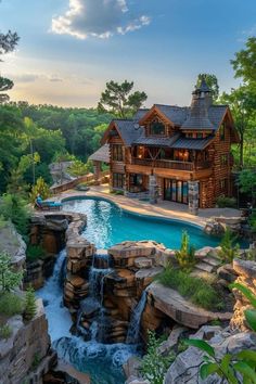 a house with a pool in the middle of it and a waterfall running through it