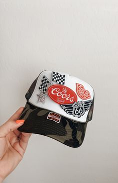 This custom made trucker patch hat is perfect for any occasion whether it be for spring/summer time, a lake hat, a gift for someone, or just a cute accessory to add a little spice to your outfit 🧢✨ DETAILS-  * This hat is one size with an adjustable SnapBack that is adjustable from 20in. - 23.5in. * The color of this hat is Camo Green * The material of the hat is polyester with iron on patches  REFUNDS AND CANCELLATIONS- Every hat is handmade by me as a result, a slight variation can occur from the picture with patch size or placement. If you have any problems with your hat please message me within 24 hours of receiving your order and I'd be happy to help! No refunds or exchanges will be accepted after. PRODUCTION TIME- The turn around time is 5-7 business days not including shipping.  CO Trucker Patch Hats, Custom Patch Trucker Hats, Custom Trucker Hats Patches, Patch Hat Ideas, Trucker Hat Patches, Patch Trucker Hat, Boujee Hippie, Trucker Hats With Patches, Trucker Hat Designs