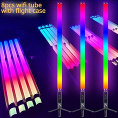 four different colored tubes are shown in the dark with neon lights on them and one is lit up