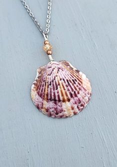 Beautiful purple calico scallop seashell on stainless steel necklace. Perfect for any mermaid! Hand selected from world-famous Siesta Key Beach, Florida! No mollusks are ever harmed in the making of my jewelry. Shell Jewelry With Lobster Clasp As Gift, Shell Shaped Wire Wrapped Jewelry Gift, Wire Wrapped Shell Necklace Gift, Wire Wrapped Shell Jewelry For Gift, Wire Wrapped Shell Jewelry As Gift, Nickel-free Shell Jewelry In Ocean-inspired Style, Ocean-inspired Nickel-free Shell Jewelry, Nickel-free Ocean-inspired Shell As Gift, Shell-shaped Wire Wrapped Necklace For Gift