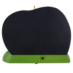 an apple shaped computer mouse pad sitting on top of a green stand with a yellow tip