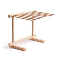 a wooden rack with four legs on it