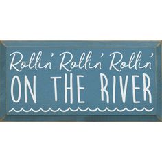 a sign that says rollin'rollin'on the river in white lettering