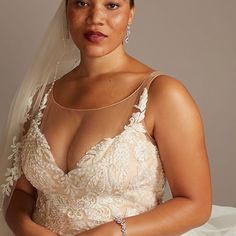 a woman in a wedding dress is posing for the camera with her hands on her hips