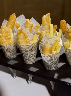 small cups filled with food sitting on top of a table