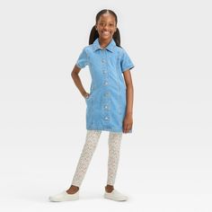 Amp up their summer dressing style with this Short-Sleeve Medium Wash Denim Dress from Cat & Jack™. Crafted from cotton denim fabric in a medium wash, this short-sleeve dress is tailored in a midi length to keep them comfortable during any activity. The collared neckline with front button-down makes for easy on and off, while side pockets add functional detail to their look. They can pair this denim dress with a range of footwear to complete the look. Cat & Jack™: Designed for all children so yo Summer Casual Denim Dress For Playtime, Casual Summer Denim Dress For Playtime, Cute Denim Blue Cotton Dress, Cute Cotton Denim Dress In Denim Blue, Blue Denim Summer Dress For Playtime, Blue Denim Dress For Playtime In Spring, Cute Cotton Denim Dress, Cute Short Sleeve Denim Dress, Cute Denim Dress With Pockets For Summer