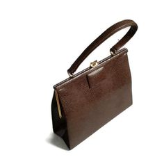 Brown Vintage bags for women. This is a vintage brown handbag. Approximately 1940-1950 years. In a very good condition. Metal Stainless Steel Fittings. Coffee brown bagDimensison:height 20 cm (8 inches) width 25 cm (10 inches) thickness 8 cm (3 inches) length of the handle 35 cm (14 inches)  Vintage bagsfor womenBrown handbags50s kelly bagReptile handbag 40s1950s Reptile PurseEveryday bagTop Handle Bagssmall leathershoulder bagsClassic bagKelly stylesimple handbag Cheap Vintage Shoulder Bag For Business, Classic Luxury Brown Evening Bag, Elegant Vintage Brown Top Handle Bag, Vintage Brown Rectangular Shoulder Bag, Vintage Brown Shoulder Bag For Office, Vintage Brown Office Bag, Vintage Office Tote Bag, Retro Brown Formal Bags, Mid-century Brown Rectangular Shoulder Bag