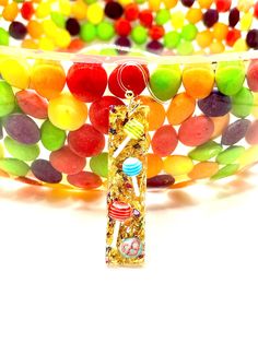 a close up of a bracelet made out of gummy bears and jellybeons