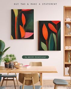 two paintings hang on the wall above a dining room table with chairs and a plant