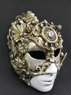 Full Face Venetian Mask,Baroque Mask,gold leaf and silver leaf Traditional and original papier-mache Venetian mask, handmade and decorated with resin,gold leaf,swarovski and wax. All our masks are handmade papier-machè masks made in Venice. Our decorators use techniques typical of the Venetian tradition such as stucco, acrylics, gold and silver-leaf, macramè, passementerie, pearls and crequelè to give you a wide range of masks. This shape is available in many different designs, colors and techni Gold Baroque Masquerade Mask, Gold Baroque Masks And Prosthetics For Costume, Venetian Masks Art, Mascara Papel Mache, Venice Mask, Mask Aesthetic, Fantasy Ideas, Venetian Masquerade, Masquerade Costumes