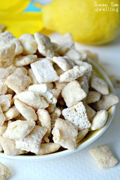 a white bowl filled with dog food next to lemons