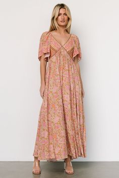 Step into timeless elegance with our Evanthia Vintage Blush print maxi dress, crafted from lightweight Rayon fabric and featuring a V-neckline with an ascending point bodice detail. Embrace sophistication and grace with this stunning piece perfect for any special event. Bohemian Dress With Smocked Back And Flutter Sleeves, Feminine Flutter Sleeve Maxi Dress With Smocked Back, Feminine Maxi Dress With Smocked Back And Flutter Sleeves, Feminine Short Sleeve Maxi Dress With Smocked Back, Pink Short Sleeve Dress With Smocked Back, Feminine Floral Print Dress With Butterfly Sleeves, Flowy Pink Dress With Smocked Back, Pink Flowy Dress With Smocked Back, Pink Flutter Sleeve Dress With Ditsy Floral Print