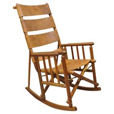 a wooden rocking chair on a white background