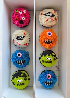 cupcakes decorated to look like monsters in a box