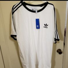 Men's Adidas T-Shirt White Relaxed Fit T-shirt With Three Stripes, Adidas White Sporty T-shirt, White Adidas Sporty T-shirt, Adidas Sporty Short Sleeve T-shirt, Adidas Short Sleeve T-shirt With Three Stripes, Basic Three Stripes Crew Neck T-shirt, Adidas Three Stripes T-shirt For Streetwear, Basic Adidas T-shirt With Three Stripes, Adidas Basic T-shirt With Three Stripes