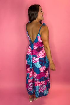 This stunning Maxi Dress is not only head turning but also so comfortable. The soft material is super lightweight so even on the hottest day you'll feel the breeze. Perfect to dress up for a vacation dinner date or dress down with some sandals for the beach Adjustable tie straps FIT: Runs big, size down. Model is a size 8, wearing a medium, but also could have worn the small. 95% Polyester, 5% Spandex V-neck Vacation Dress With Knotted Straps, V-neck Dress With Knotted Straps For Vacation, Beachy Tie-back Dress For Poolside, Beachy Tie Back Dress For Poolside, Beachy Dress With Tie Back For Poolside, Summer V-neck Maxi Dress With Tie Fastening, Pink Maxi Dress With Tie Straps For Summer, Pink Tie Straps Maxi Dress For Beach, Beach Sundress With Knotted Straps For Spring