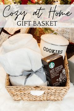 the cozy at home gift basket is filled with coffee, cookies, and other items