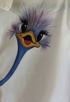 an emu painted on a white shirt with purple hair and blue eyes is shown