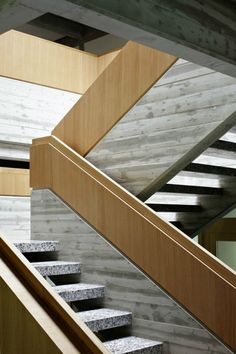 the stairs are made of concrete and wood