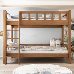 a wooden bunk bed sitting on top of a hard wood floor next to a table