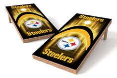 two cornhole game boards with the pittsburgh football team on them