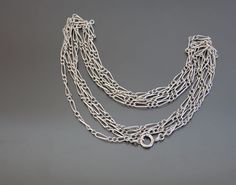 "First quarter of the 20th century, Germany.  Link guard chain in 800 silver  design popular in Edwardian period. Hallmark hard to read, metal was tested. Excellent antique condition, with minimal wear. I noticed no repairs.  Spring ring clasp works fine.  Length from end to end: 58 1/2\"   (148,5cm).  Weight:  20,4g.  * * * All our items are packed in gift boxes, easy to check of content and re-pack. If you wish something special, please let us know." Edwardian Necklace, Austria Hungary, Silver Chain Style, Silver Design, Lovely Necklace, Lovely Earrings, Chain Styles, Spring Rings, Gift Boxes