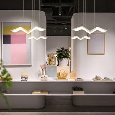 a room filled with lots of different types of furniture and decor on top of white counter tops