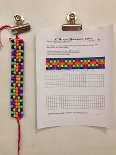 a piece of paper that has some beads on it next to a clipboard with a graph