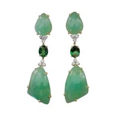 Free-form cabochons of green beryl (origin: Brazil) are perfectly book matched in these dramatic dangle earrings. Beryl is a large family of gems. Well known members include emerald and aquamarine. Lesser known but equally beautiful members are Morganite (pink) and heliodor (also known as golden beryl). These gems are a luscious "lime sherbet" color and possess a glass-like polish. Complimenting the beryls are a pair of forrest green topaz along with white diamonds. All are set in hand fabricate Green Long Drop Earrings For Formal Occasions, Formal Green Earrings With Gemstone Accents, Green Earrings With Gemstone Accents For Formal Events, Lime Sherbet, Golden Beryl, South Sea Pearls Earrings, Bridal Jewels, Green Topaz, Diamond Dangle Earrings