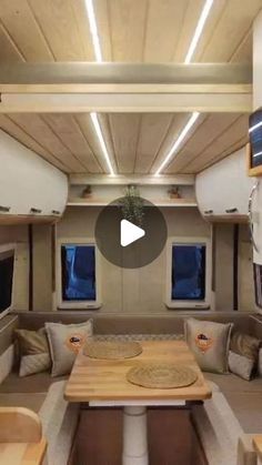 the inside of an rv with couches and tables