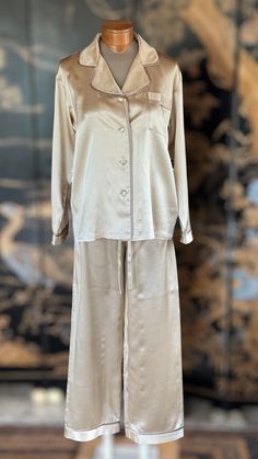 These high-end charmeuse silk pajamas are 100% natural, allergen-free and hypoallergenic. Kumi Kookoon is world-renowned for its fine, high quality silk products. Handmade 100% charmeuse silk Color: Ivory Measurements: SmallChest width: 20.5"Sleeves: 21.5"Elastic waistHips: 21.5"Pants length: 40.4" MediumChest width: 22"Sleeves: 23"Elastic waistHips: 23"Pants length: 42" LargeChest width: 23"Sleeves: 23.5Elastic waistHips: 24"Pants length 43" Chic Silk Sleepwear With Satin Finish, Elegant Long Sleeve Sleepwear Set, Chic Silk Long Sleeve Sleepwear, Chic Long Sleeve Silk Sleepwear, Elegant Satin Sleepwear For Pajama Party, Elegant Satin Sleepwear, Elegant Silk Sleepwear Sets, Elegant Silk Sleep Sets, Elegant Cream Sleepwear For Home