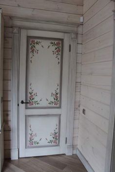 an open door with flowers painted on it