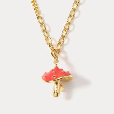 Step into a whimsical world with our Mushroom Necklace, where nature's enchantment takes center stage! 🍄✨ This delightful necklace features a charming mushroom pendant, designed with intricate details and a touch of magic. Let it grace your neckline, adding a playful and nature-inspired touch to your style. Embrace the charm of the mushroom kingdom and let your imagination flourish!  DETAILS Plating: 18K Gold Materials:   18K Gold on Brass, Enamel Length:  18.90 "(48cm) + Extender: 1.97"(5.0cm) Whimsical Gold Jewelry With Mushroom Design, Gold Mushroom Pendant Necklace, Mushroom Shaped Necklace For Gifts, Mushroom Design Necklace Gift, Whimsical Mushroom Design Necklace For Gift, Whimsical Mushroom Print Jewelry Gift, Mushroom Design Necklace As Gift, Mushroom Design Necklace For Gift, Mushroom Design Necklace For Gifts