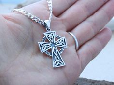 "This sterling silver pendant is just Amazing!! this Celtic Cross necklace is not just beautiful in design but also in meanings, this pendant is a symbol which emphasizes the endlessness of love of God shown through the sacrifice of Jesus on the Cross. The Celtic knot at the bottom of the cross represents friendship, affection, that cannot be broken. The trinity design on the arm of the Cross symbolizes God's love around the Holy Trinity. Also, It represents the three promises of a relationship Hallmarked Silver Cross Necklace, Silver Symbolic Cross Necklace, Silver Hallmarked Cross Necklace, Hallmarked Sterling Silver Cross Necklace, Handmade Stainless Steel Cross Jewelry, Silver Spiritual Cross Pendant Necklace, Spiritual Silver Cross Pendant Necklace, Silver Cross Pendant Jewelry, Silver Chain Cross Jewelry