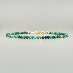 "Fall in love with our dainty emerald gemstone beaded bracelet, perfect timeless delicate minimalist design, designed to be stacked or worn on its own. Will make a thoughtful birthday, christmas. anniversary gift for your wife, mother, sister, daughter, or friend. Emerald is May birthstone- a prefect gift for someone born in May under Taurus zodiac sign. Also, perfect 20th wedding anniversary gift. Your purchase will arrive elegantly packed  in a gift-ready suede storage bag  and will include a Green Crystal Bracelet, 20th Wedding Anniversary Gifts, 20th Wedding Anniversary, Born In May, Taurus Zodiac Sign, 20 Wedding Anniversary, Emerald Bracelet, Bracelet Minimalist, Emerald Bead