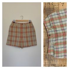 "Awesome high waisted 90's plaid shorts. High waisted fit, looser through the hips, and two front pockets. Button and zipper closure in front. Classic 90's multi colored plaid pattern. Shorts are in excellent clean condition. Measurements are taken zipped or buttoned up and laid comfortably flat then x 2 for total circumference (inches) Liz Claiborne Tag Size 10 100% Cotton Waist 28\" Hips 42\" Length 16.5\" Inseam 5\" Rise 12\" Bottom leg Opening Circumference 26\" All items are free of rips, t Fitted Plaid Shorts, Vintage High Waist Plaid Bottoms, Plaid High-waisted Fitted Shorts, Fitted Plaid High-waisted Shorts, Retro Plaid Short Bottoms, Retro Plaid Short-length Bottoms, Vintage Plaid Bottoms For Summer, Vintage Plaid Summer Bottoms, Levi High Waisted Shorts