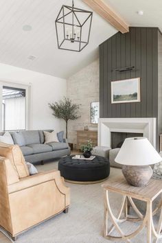 a living room filled with furniture and a fire place