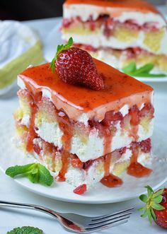 a piece of cake with strawberries on top