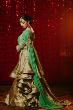 Sadia - Contemporary Asymmetrical Green Bridal Saree Style Lehenga with pearl work Look like a modern bride of today's time and take the dance floor by storm in this unique ensemble saree like lengha! Asymmetric one-shoulder designer blouse with pre draped feature & pearl work Georgette fabric used to give you the benefit of a good drape feature Modern single-shoulder detail with pre draped saree like pleats makes this piece an absolute stunner Interesting crystal beadwork runs all over neckline Floor-length Pre-draped Saree With Gota Work For Wedding, Reception Art Silk Dupatta With Tilla Detail, Art Silk Dupatta With Tilla For Reception, Reception Choli With Gota Work And Traditional Drape, Traditional Drape Choli With Gota Work For Reception, Festive Pre-draped Saree With Tilla In Traditional Drape, Festive Pre-draped Saree With Tilla, Pre-draped Saree With Gota Work For Wedding And Festivals, Green Pre-draped Saree With Gota Work For Wedding