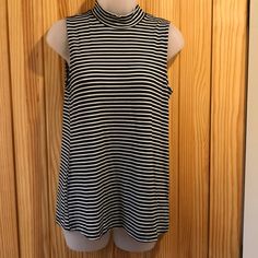 Nwot-Black And White Horizontal Stripes. Sleeveless. Small Turtleneck. Last Picture Is Best For Color Depiction. Size Small. Measurements Front Laying Flat: Across: Shoulders 12, Under Arms 17", Waist 17 ½", Bottom 21"; Length: Shoulders @ Neckline Down 26", Down Middle From Bottom Of Neckline 25", 1 ½" Turtleneck, Arm Openings 8" Bought But Never Wore Perfect Condition 4 For $25any 4 Tops Similarly Marked Get For $25 ($6.25 A Shirt) + Single Shipping Fee-Just Add To Bundle Or Message Me! Striped Sleeveless Blouse For Spring, Sleeveless Striped Stretch Tops, Striped Sleeveless Stretch Top, Stretch Sleeveless Striped Top, Striped Stretch Tank Top, White Cotton T-shirt With Horizontal Stripes, Black Horizontal Stripe Short Sleeve T-shirt, Stripe Tee, Horizontal Stripes