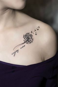 a woman with a dandelion tattoo on her shoulder