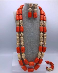 Nigerian wedding jewelry for special occasions. This is original Italian coral made into 2 steps ganished with non tarnish gold accents. The bride set includes 1 elastic bracelet and a set of earrings. Production takes 7 business days Feel free to start a conversation with me. Thank you. Elegant Red Coral Beads For Jewelry Making, Handmade Red Coral Festive Jewelry, Festive Handmade Red Coral Jewelry, Hand-strung Red Coral Jewelry In Coral Color, Elegant Orange Red Coral Beads, Handmade Red Coral Wedding Jewelry, Hand-strung Red Coral Jewelry, Traditional Red Coral Festive Jewelry, Gold Red Coral Jewelry For Wedding