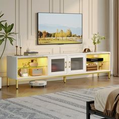 a living room scene with focus on the entertainment center and large screen tv in the background