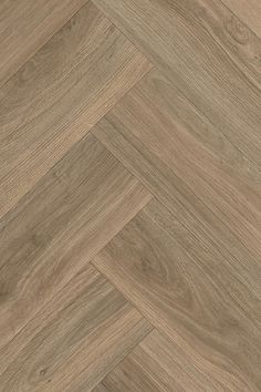 A realistic wood-effect cushion vinyl herringbone patterned floor by LeoLine Flooring.