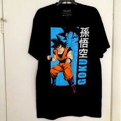 This Is A A Brand New Tee Shirt That Has Never Been Worn Before Black Tops With Front And Back Print For Fans, Black Shirt With Front And Back Print, Relaxed Fit, Black Anime Print Crew Neck Top, Black Crew Neck Top With Anime Print, Black Short Sleeve Fan Apparel Shirt, Black Streetwear Shirt With Character Print, Black Fan Apparel Top With Front Print, Black Casual Top With Anime Print, Casual Black Top With Anime Print