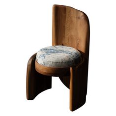 a wooden chair with a blue and white cushion on it's backrest, against a white background