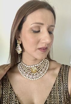 Introducing our exquisite Kundan Necklace, the epitome of elegance and opulence. This stunning piece has just arrived in stock and boasts the highest quality craftsmanship and an unparalleled shine. Handcrafted by master artisans, the necklace features intricately set Kundan stones that radiate brilliance from every angle. Perfect for special occasions or to elevate your everyday look, this necklace is a timeless addition to any jewelry collection. Experience the luxury and grandeur of our fines Opulent Hand Set Necklace For Gift, Luxury Jeweled Necklaces For Celebration, Heavy Dazzling Necklaces For Festive Occasions, Heavy Dazzling Festive Necklaces, Luxury Crystal Jewelry Sets For Reception, Elegant Crystal Necklaces For Reception, Opulent Round Wedding Necklaces, Opulent Wedding Necklaces, Opulent Silver Necklace For Festive Occasions