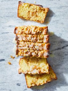 slices of cake sitting on top of a marble counter next to another piece of bread