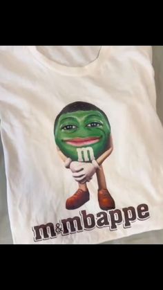 a t - shirt with an image of a green man holding a baseball bat on it