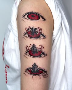 a woman's arm with three evil eye tattoos on the upper half of her arm